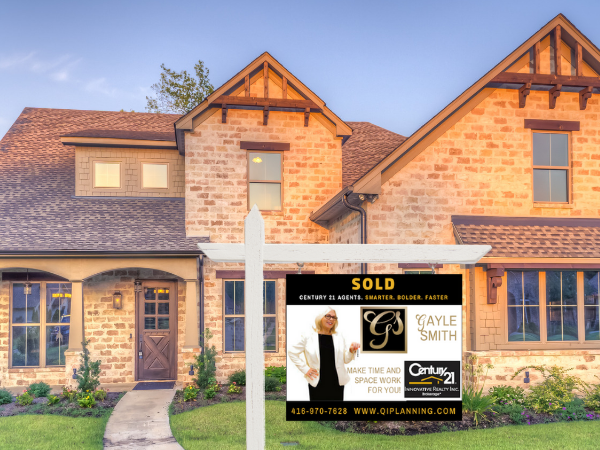 Gayle Smith Real Estate sold sign in front of house